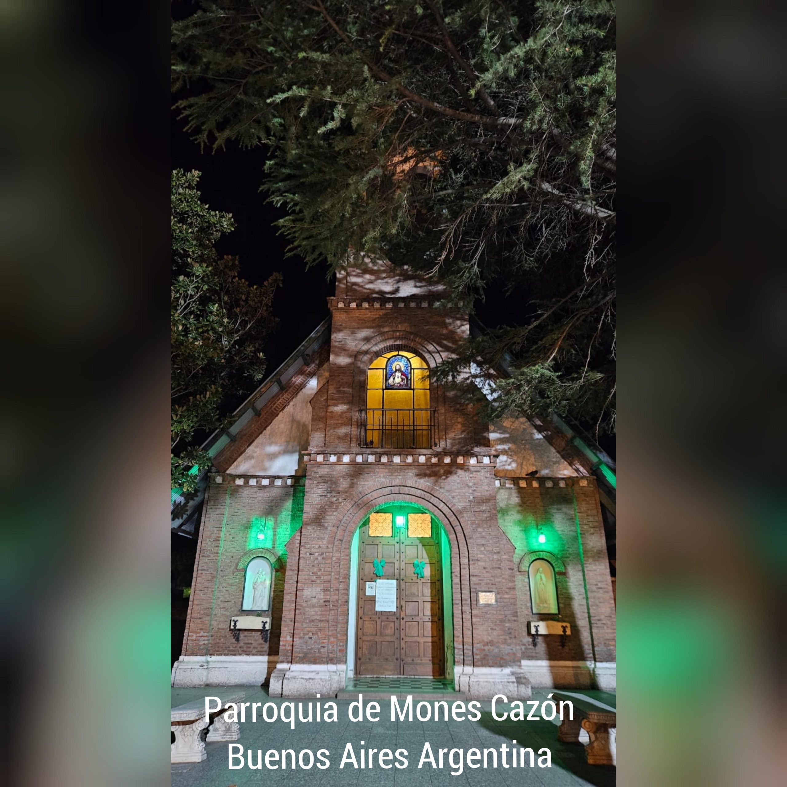 A small church with mito green lights on its facade