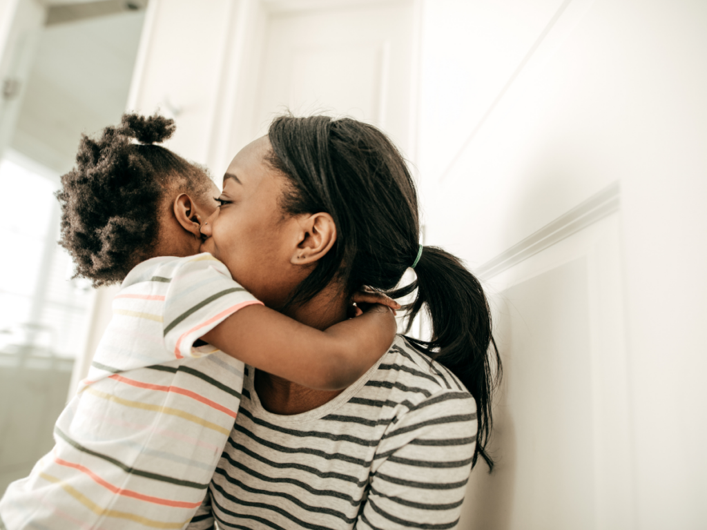 Woman hugging a child